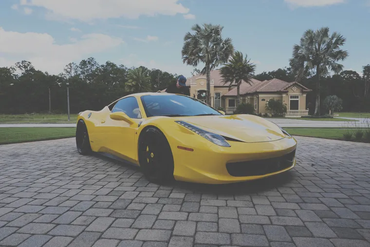 Yellow Ferrari on the driveway