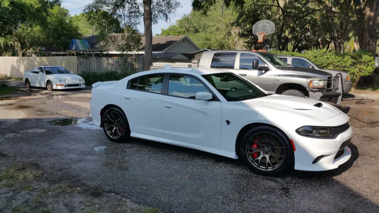 White performance sedan outdoors