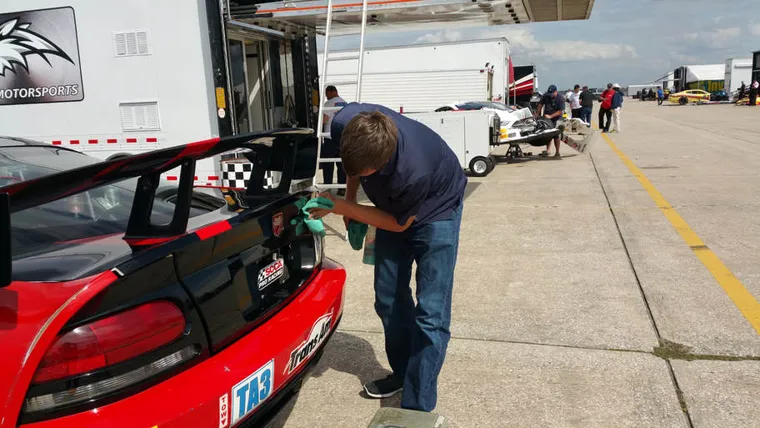 Working on a race car at the track