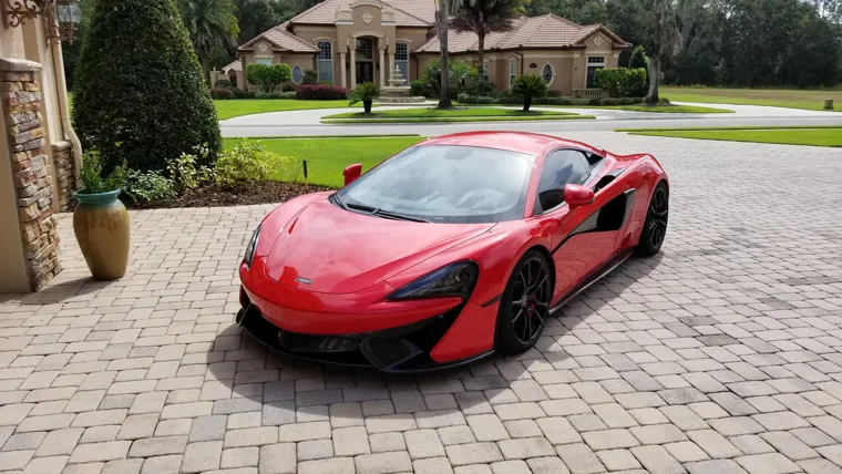 Red McLaren on the driveway