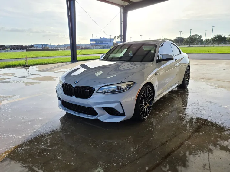 White BMW at the hangar