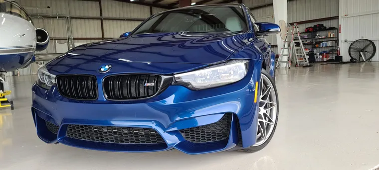 Blue BMW, front view