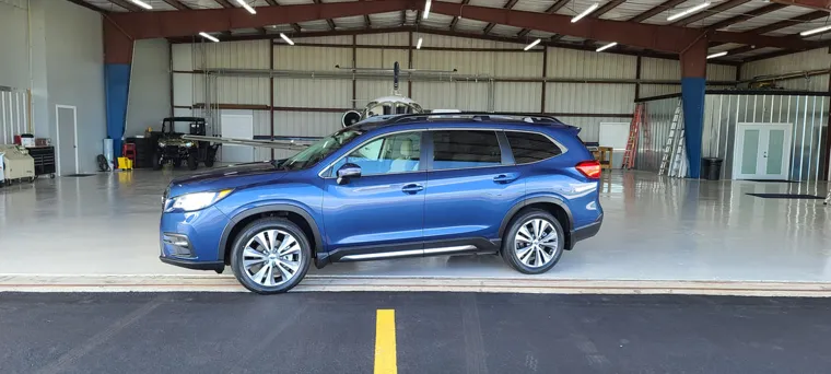 Blue SUV inside the hangar