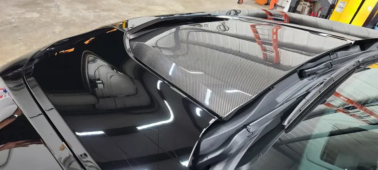 Black paint reflecting the hangar lights