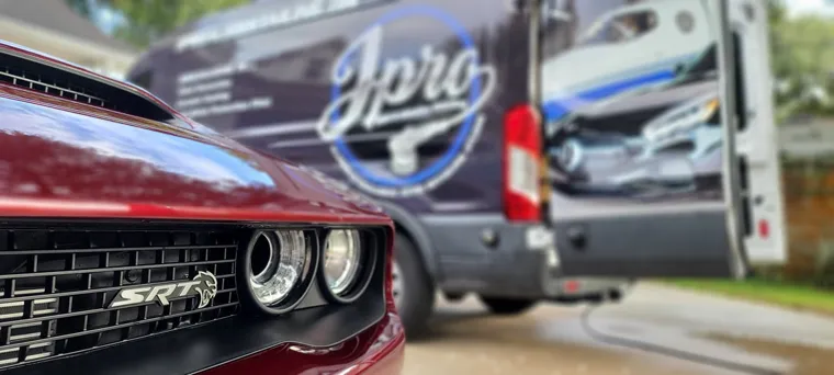 Dodge Challenger and J Pro van