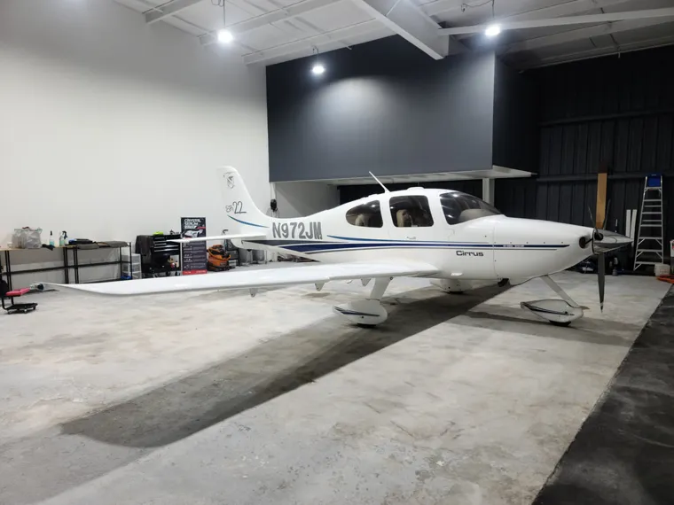 White aircraft under studio lights