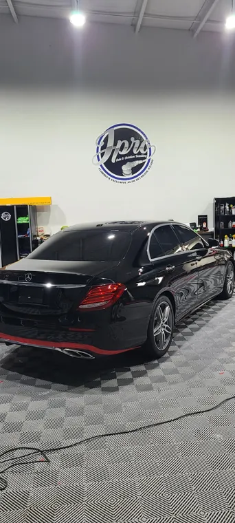 Black performance car in the studio