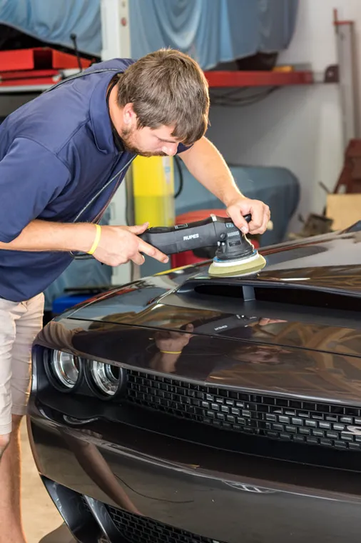 Detail work on the Challenger bonnet