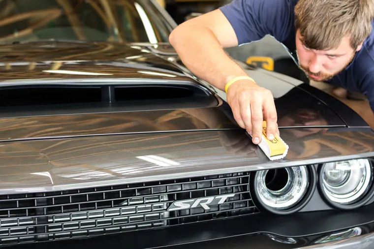 Hand-finishing a Dodge Challenger