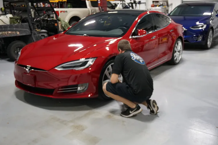 Detailing a red Tesla