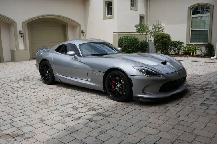 Silver Dodge Viper in the driveway