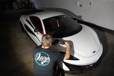 Paint correction on a white McLaren